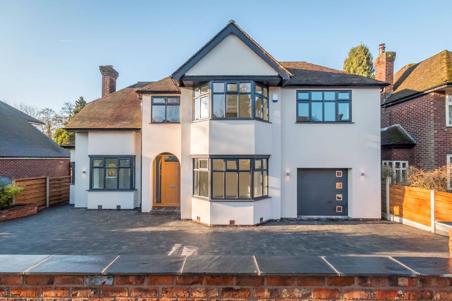 Renovated open-plan living area with feature lighting